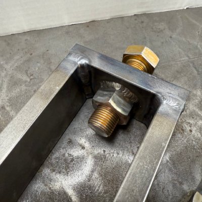 Finish welded assembly with tensioning bolt
