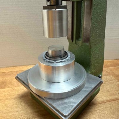 T47 cup in fixture, ready for bearing to be pressed