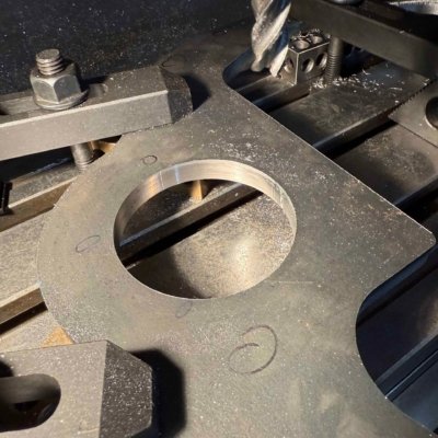 Machining a reference surface on laser cut plate